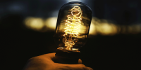 closeup-shot-human-hand-holding-lamp