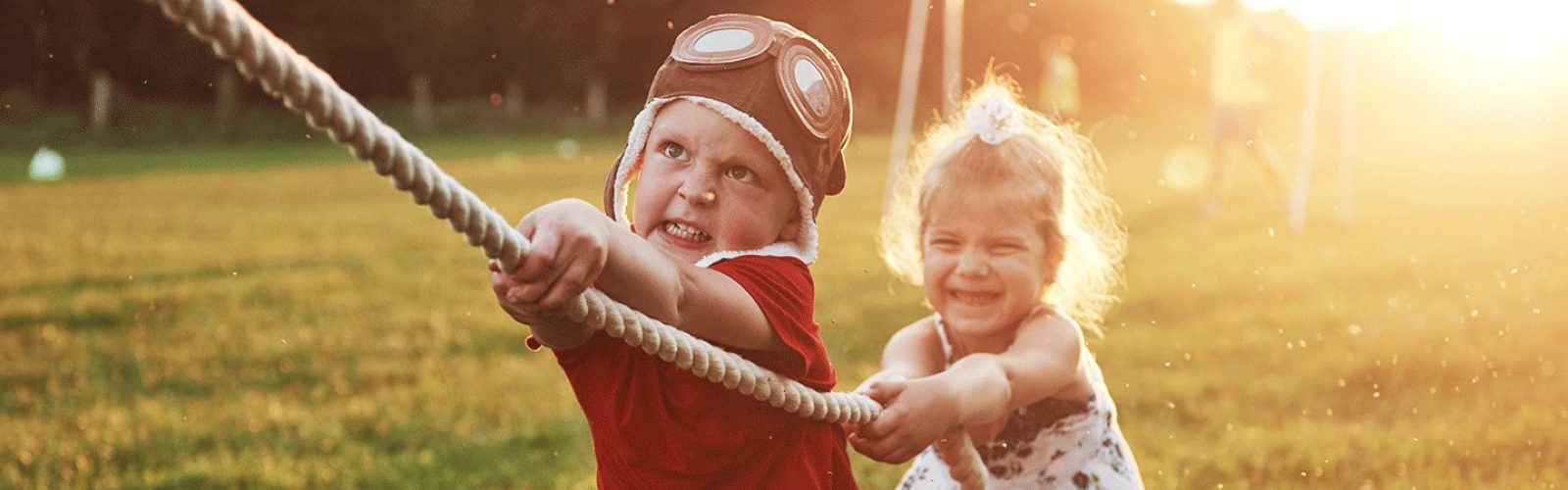 boy-girl-pulling-rope-playing-tug-war-park