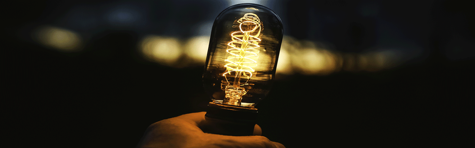 closeup-shot-human-hand-holding-lamp
